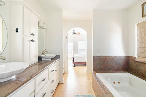 Double vanity and soaking tub in the primary bath
