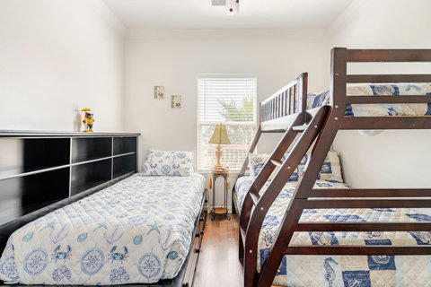 Bunk room with a twin-over-full bunk and a daybed