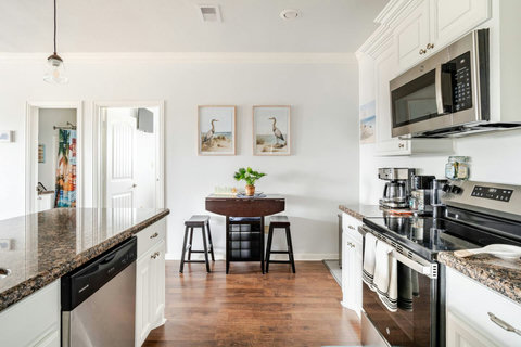 Kitchen with a cafe table and coffee station