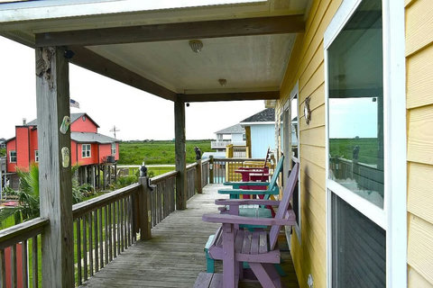 Deck chairs lined up along the house