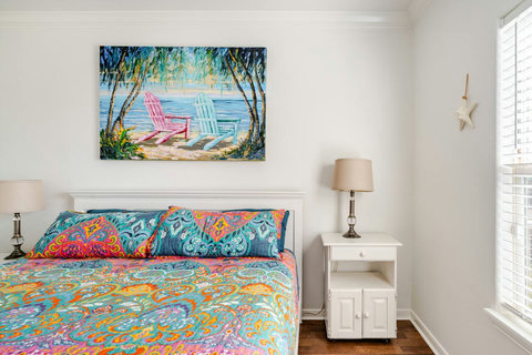Queen bed with colorful bedding