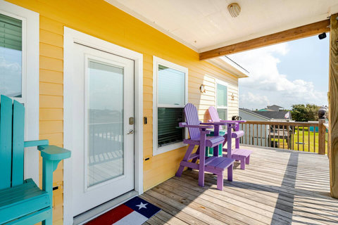 Purple Adirondack chairs on the deck