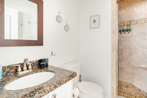 Bath with a tile walk-in shower