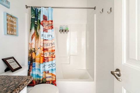 Hall bath with a tub-shower