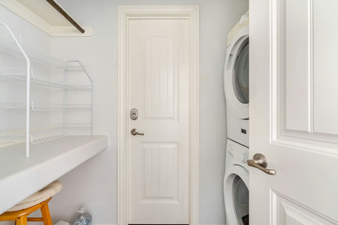 Laundry with a stacked washer and dryer