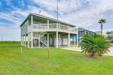 Raised beach house with a wraparound deck