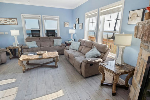 Sofas and recliners with views out every window