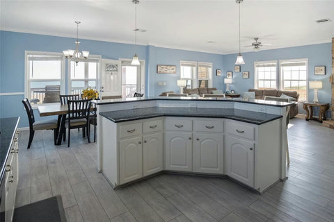 Kitchen island and dining table by the windows