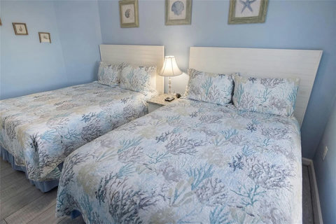 Comfy beds with soft coral bedding