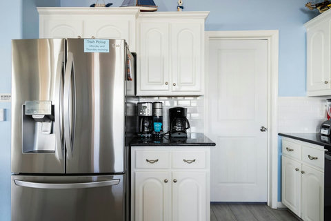 Coffee station and a big stainless fridge