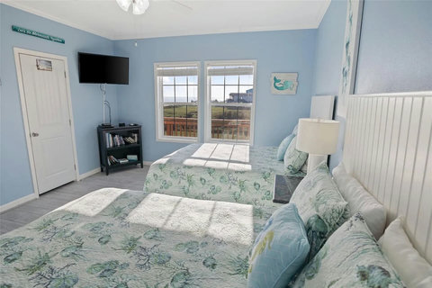 Two-bed room with views out the window