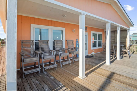 Tall deck chairs lined up along the covered deck