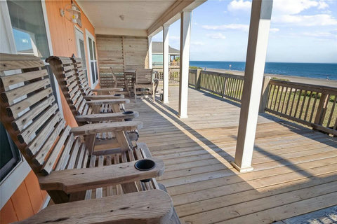 Tall deck chairs facing the water