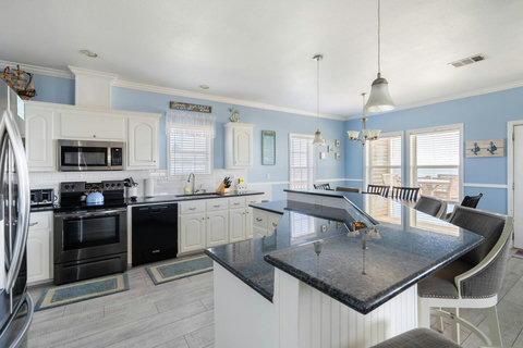 Kitchen with granite counters and lots of cabinets
