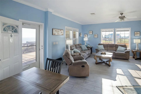 Bright living room with a door straight to the deck