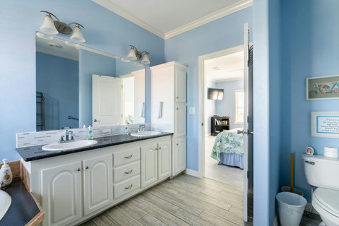 Double vanity next to the bedroom