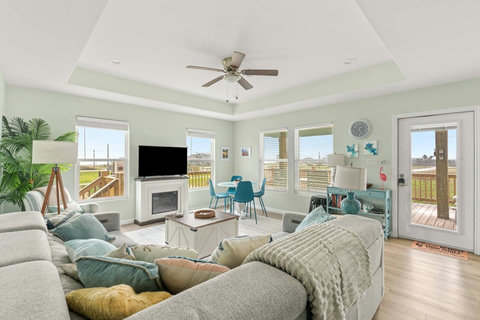 Sectional sofa and smart TV with lots of natural light