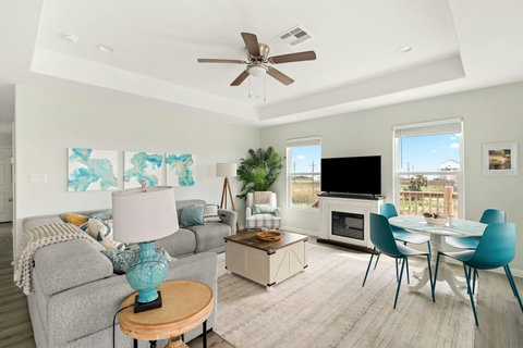 Living room with a fireplace and round dining table