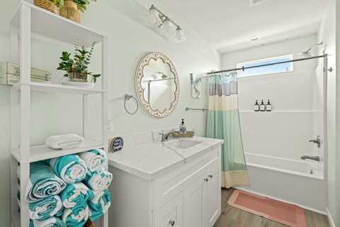 Hall bath stocked with beach towels