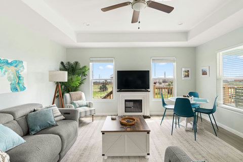 Living room with a fireplace and dining nook