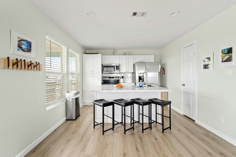 Kitchen with stainless appliances and pantry