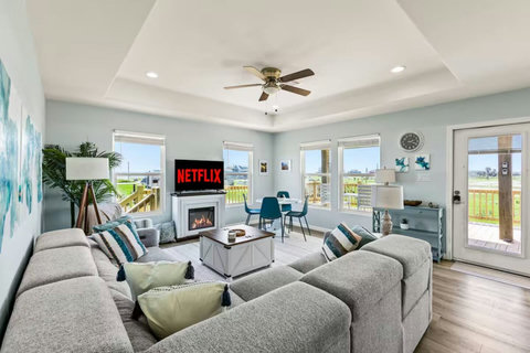 Living room with a cozy electric fireplace and big sectional