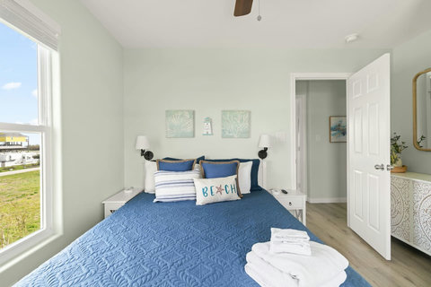 Bedroom with fresh towels waiting
