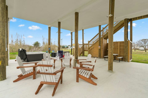 Shaded patio with chairs and the hot tub