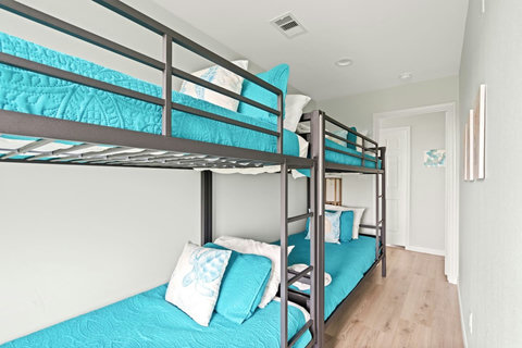 Bunks with bright aqua bedding