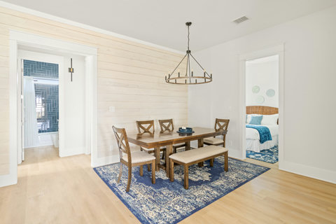 Dining area with a wagon-wheel chandelier