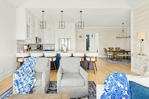 Living room looks into the kitchen and dining area