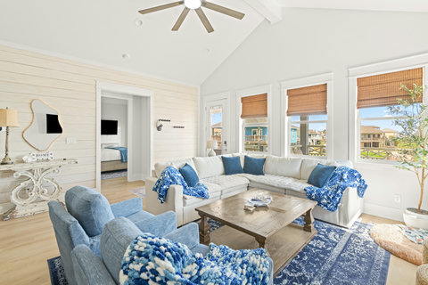 Sectional sofa and armchairs under vaulted ceilings