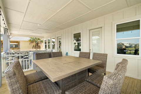 Covered deck with a dining table for eight