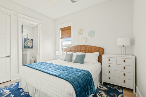 Queen bedroom with a woven headboard
