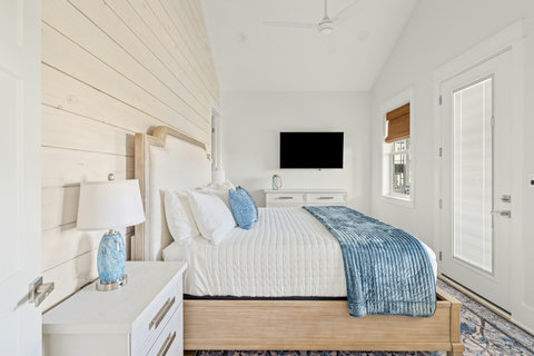 King bed with shiplap accent wall