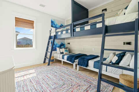 Built-in bunks with ocean-blue bedding