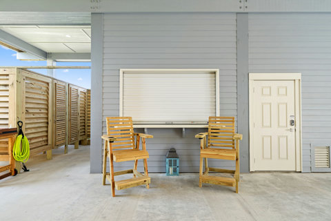 Chairs by the outdoor bar window