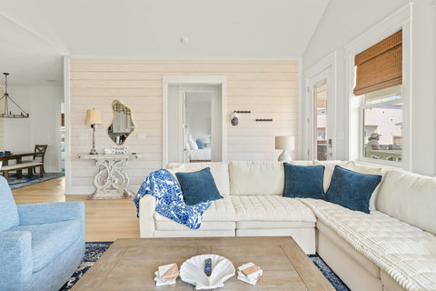 Living room with shiplap walls and plenty of seating