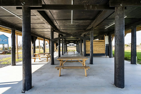 Shaded patio with picnic tables