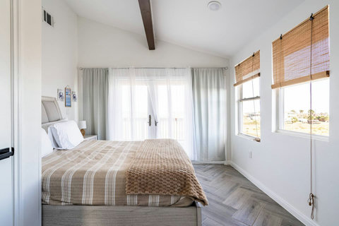 Bedroom with a queen bed and French doors