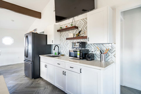 Kitchen with a smart fridge and open shelves