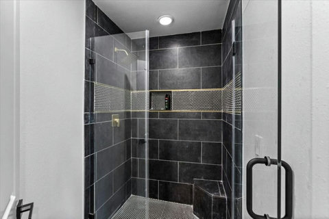 Walk-in shower with a bench