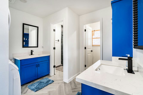 Bath with a blue vanity