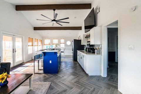 Open living area with the kitchen beyond