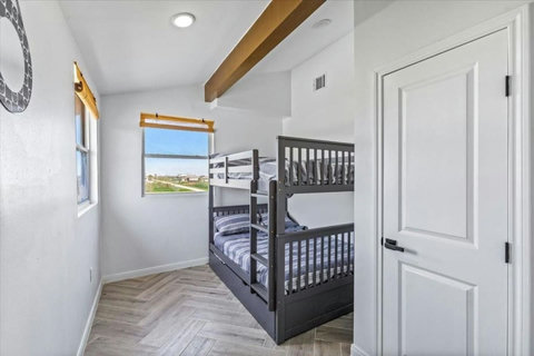 Bunk room with a window
