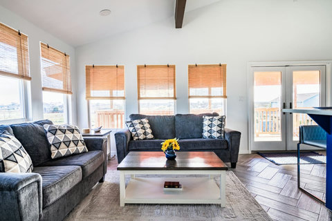 Sofas and French doors to the deck