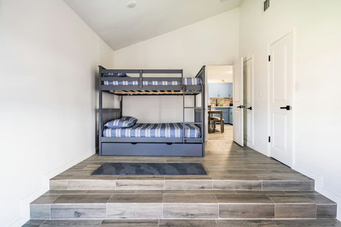 Bunk room with a twin-over-twin bunk and trundle