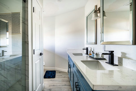 Bath with a double vanity and glass shower