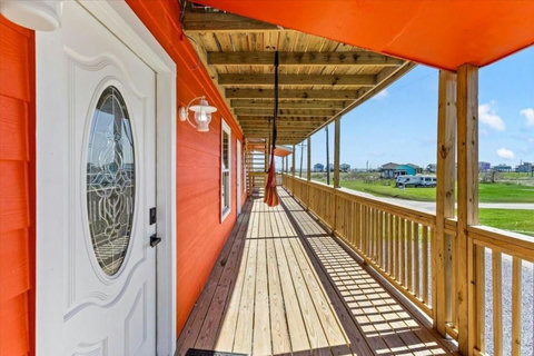 Long covered deck with a hammock