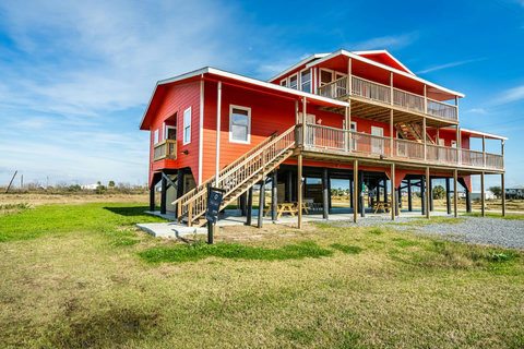 Wide lot with stairs up to the deck